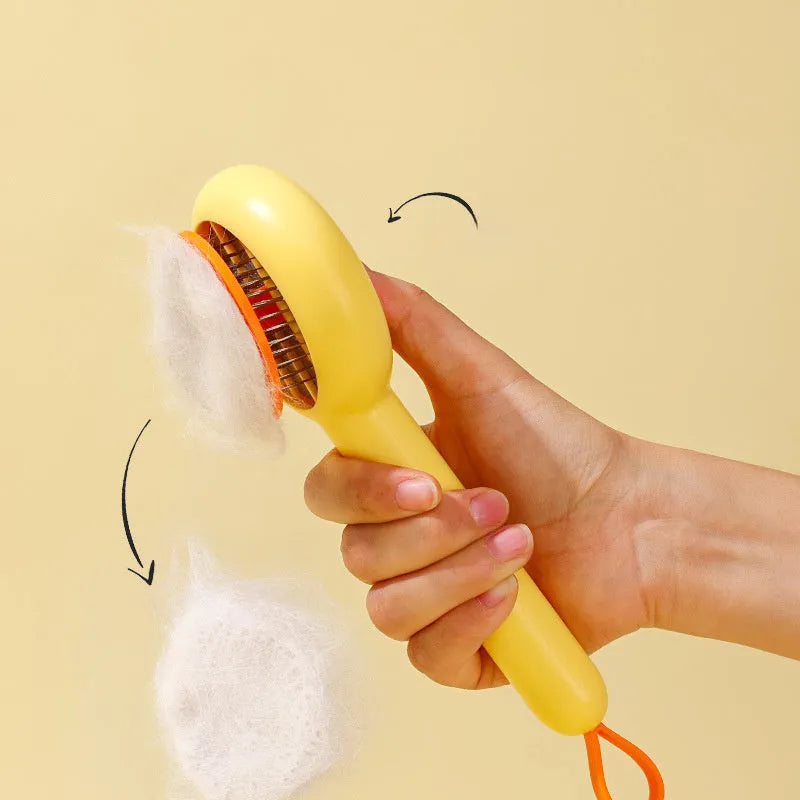 Small yellow duck-shaped pet comb with needle bristles for grooming cats and dogs