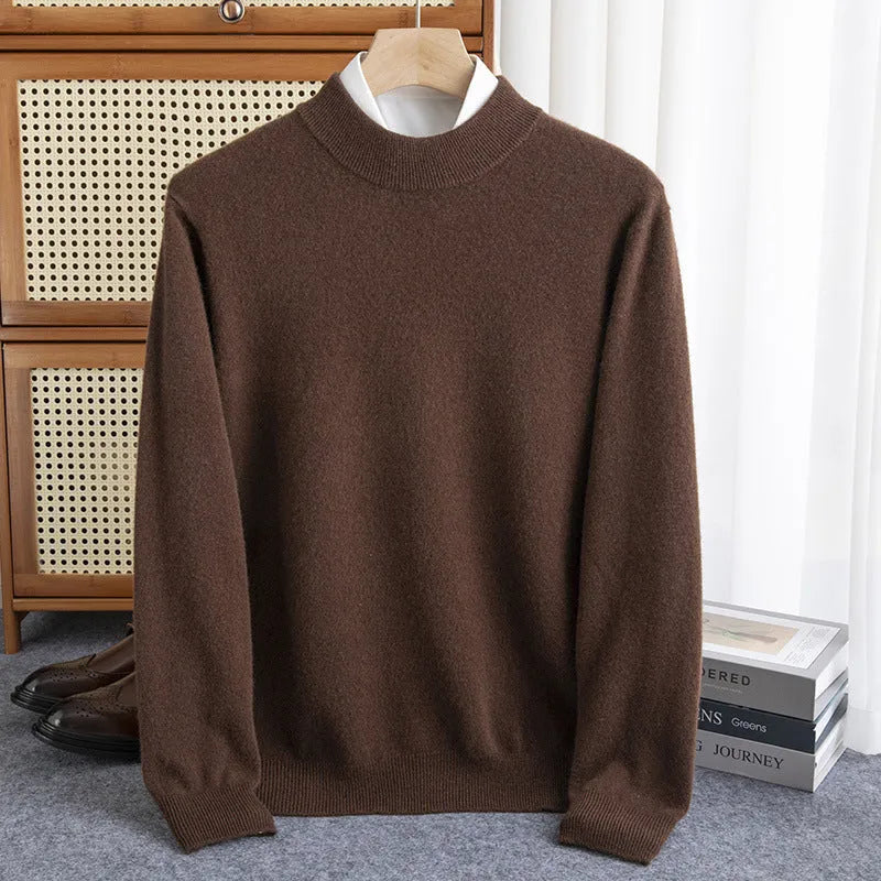 Man wearing a half-collar loose wool sweater in a textured rough yarn knit.