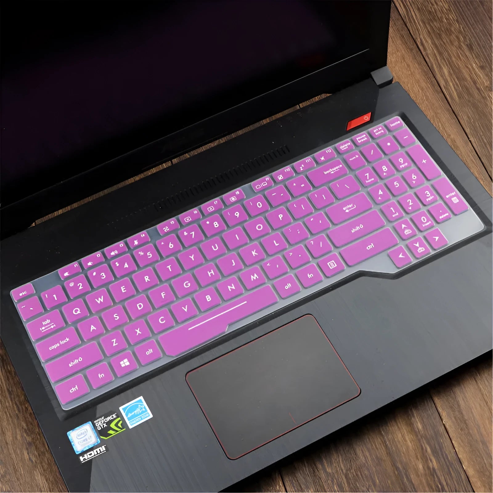 Clear protective keyboard film cover for ASUS Flight 14-inch laptop on a keyboard.