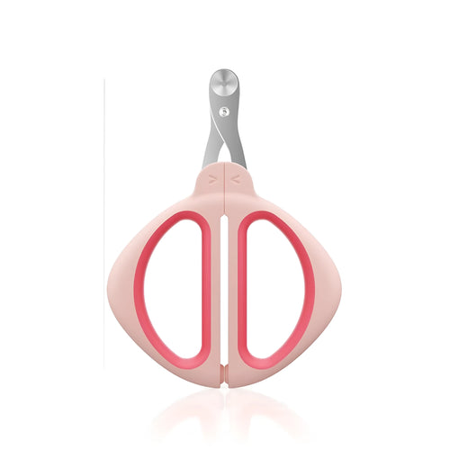 Close-up of a pink pet nail clipper showing the round positioning hole and stainless steel blade.