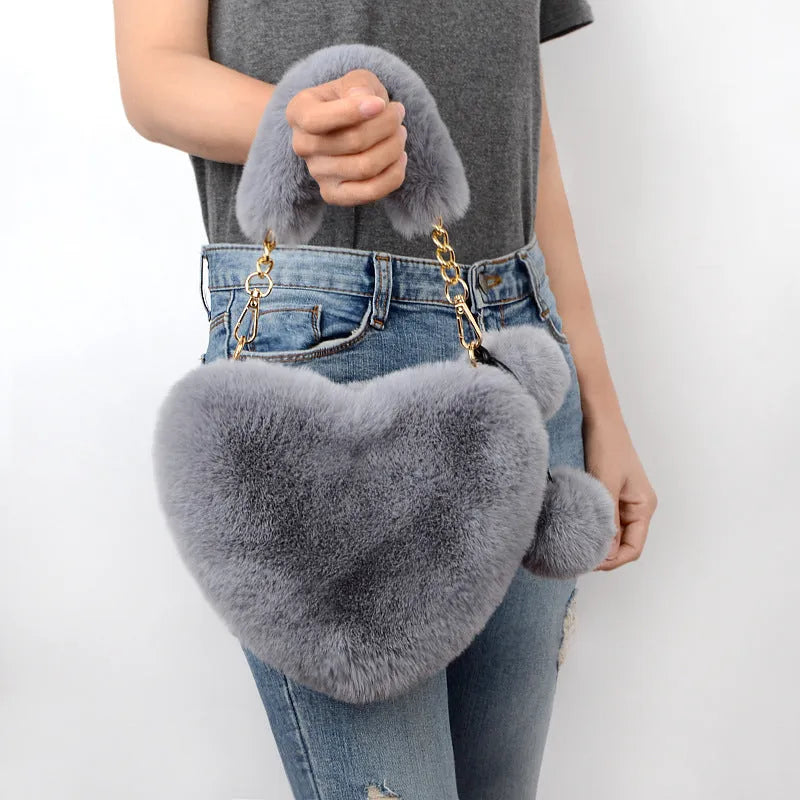 Soft plush heart-shaped women's handbag in medium size with zipper closure