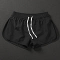 Men's loose-fit polyester surfing trousers in black, fluorescent green, and orange red colours