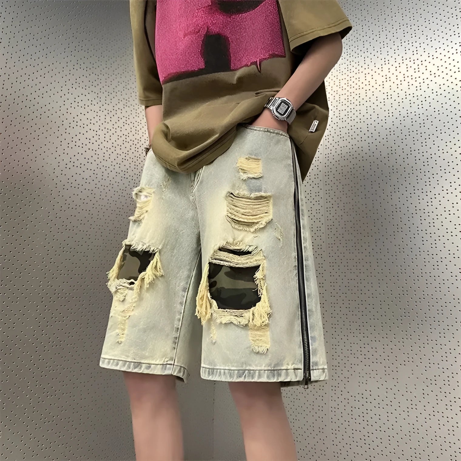 Man wearing yellow mud camouflage print cotton denim shorts with a straight-leg, fifth-length Korean style cut.
