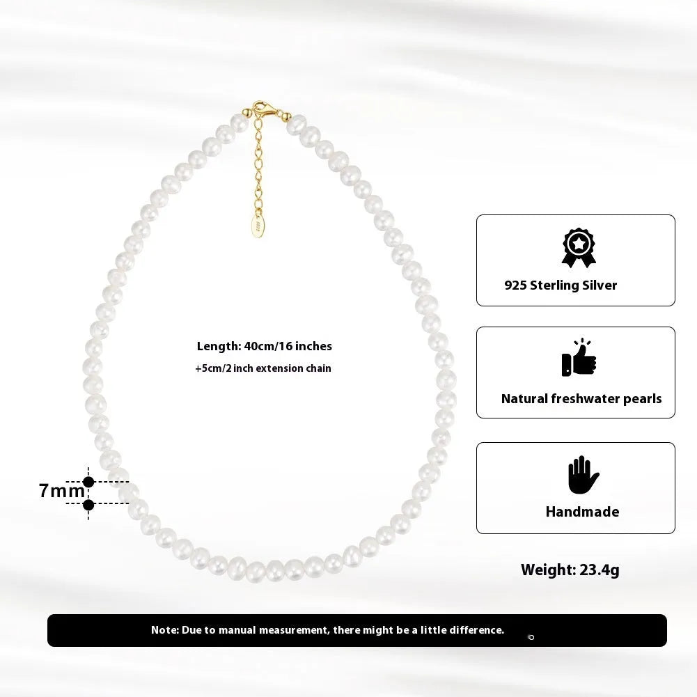 Women's adjustable silver necklace with natural freshwater pearls on a model.