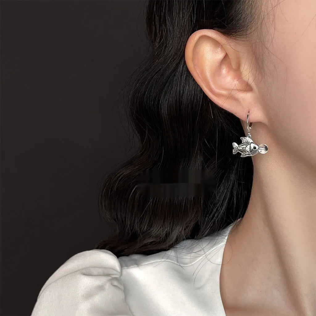 A pair of goldfish-design bubble fish earrings made from electroplated copper.
