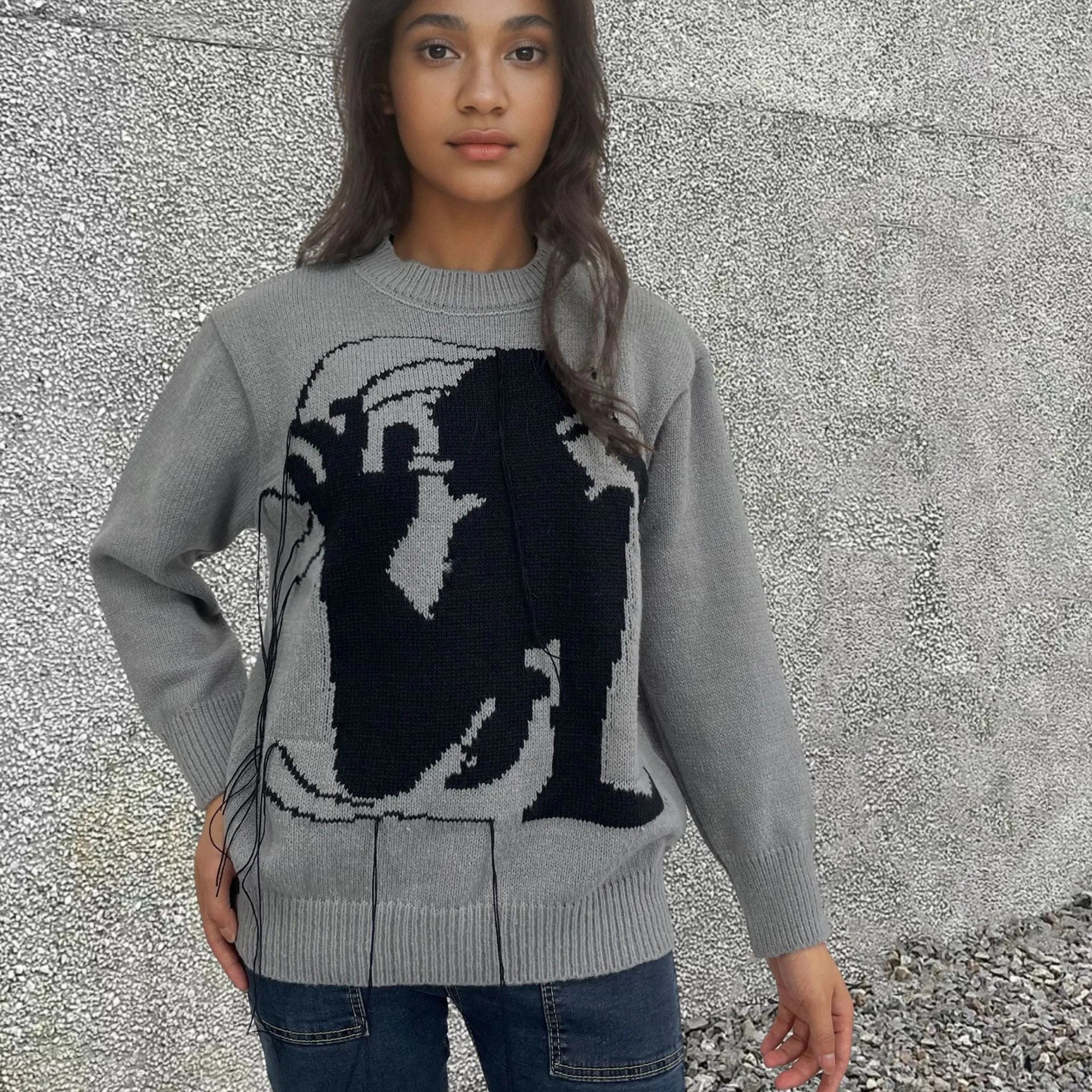 Women's loose fit alpaca wool sweater with tassel design and abstract pattern in street fashion style