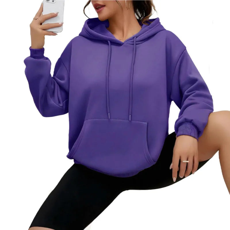 Women's loose fit grey sweatshirt with front drawstring detail and long sleeves on a hanger