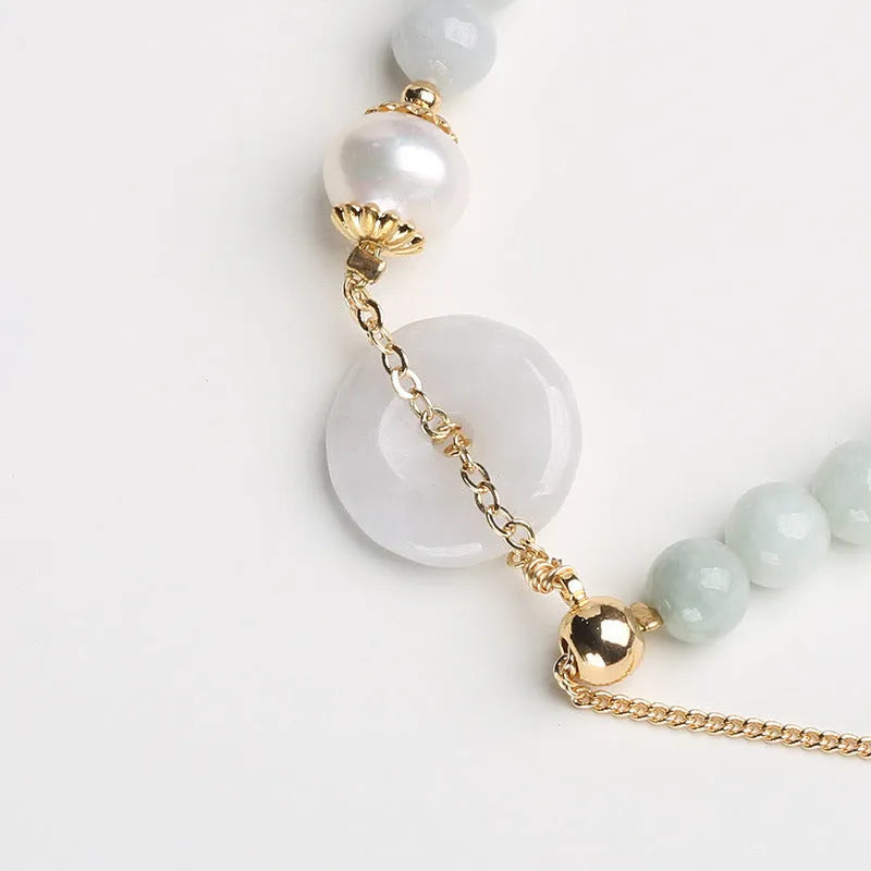 Jade and pearl bracelet with emerald peace buckle clasp and round pendant