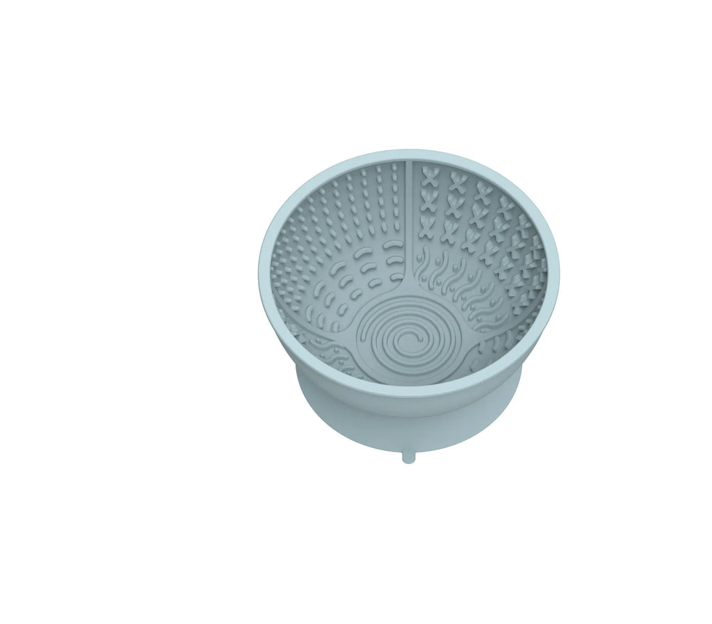 Cyan silicone pet bowl with textured licking mat surface and suction cup base