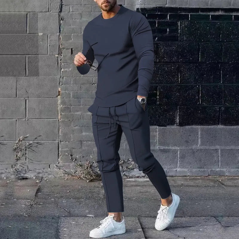 Men's solid colour two-piece polyester tracksuit with long sleeves, shown in apricot colour.