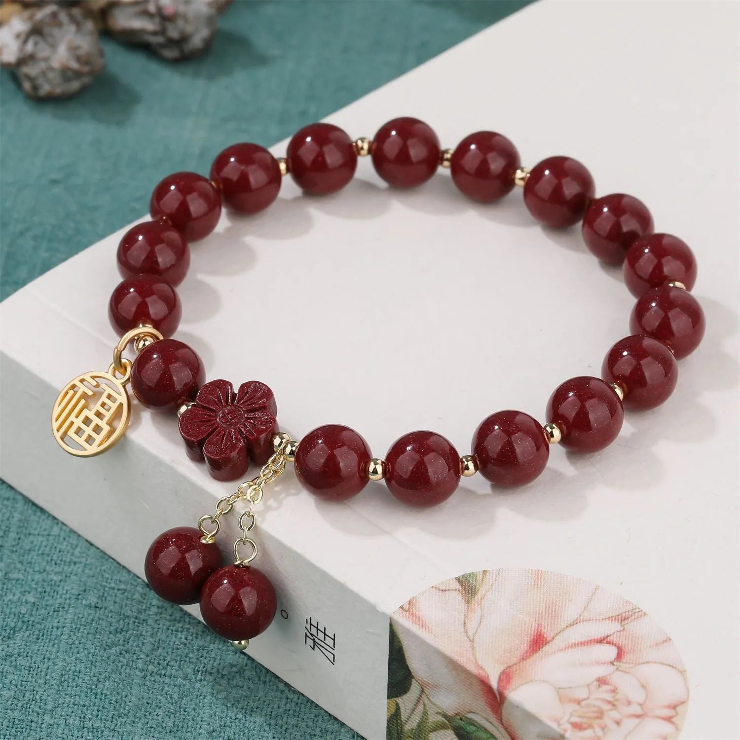 Traditional cinnabar women's bracelet with fu character centrepiece in purple and gold sand colours