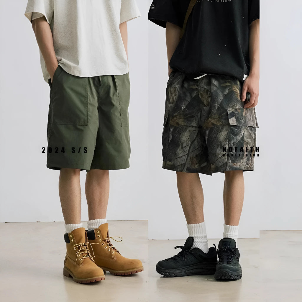 Loose straight-leg denim shorts in army green with a zip fly and elasticated mid-waist.