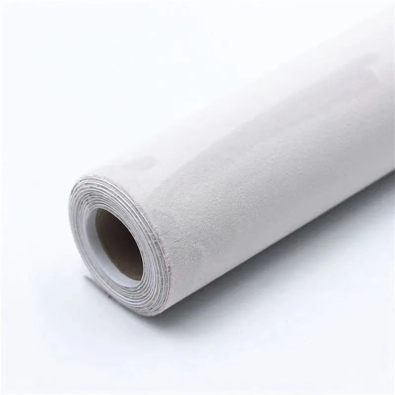 A sheet of self-adhesive black leather suede material with a ruler showing its 0.5mm thickness.