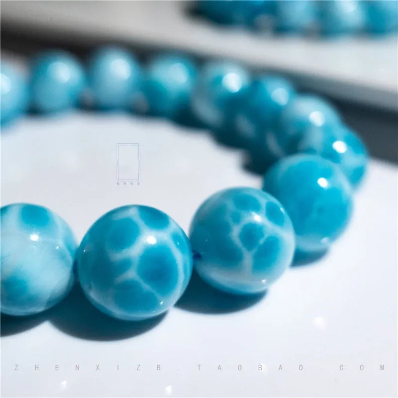 Blue Bodhi bead bracelet with natural crystal stone and pearl accents in Maillard style