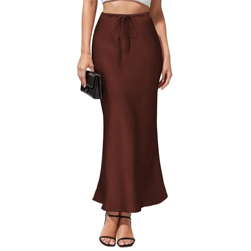 Asymmetric acetate satin skirt with high waist and irregular stitching detail in solid colour.