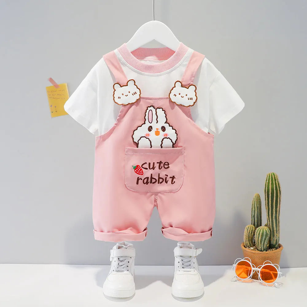 Yellow cartoon print cotton baby overalls with short sleeves and adjustable shoulder straps on a hanger.