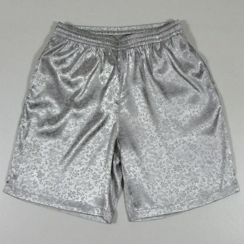 Men's black Tang Suit shorts with an elastic drawstring waistband, shown flat.