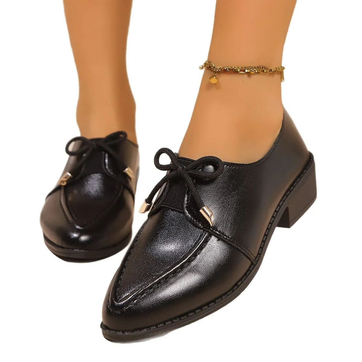 Women's British-style leather shoes with decorative bow on pointed toe, available in three bow style variations