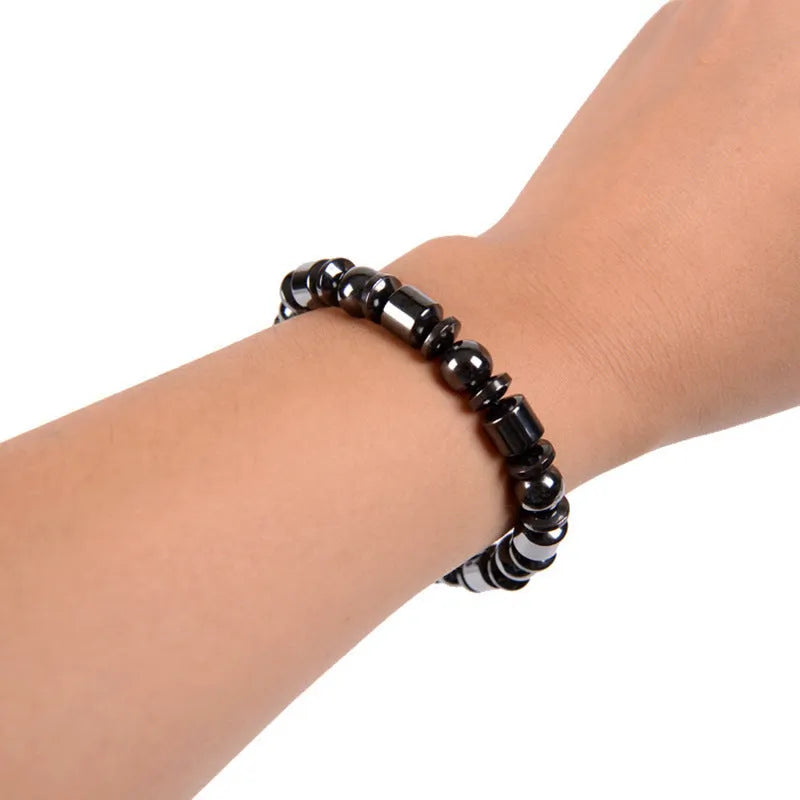 Black pentagram magnetic therapy bracelet made from magnetite and hematite stones with a stretch fit.