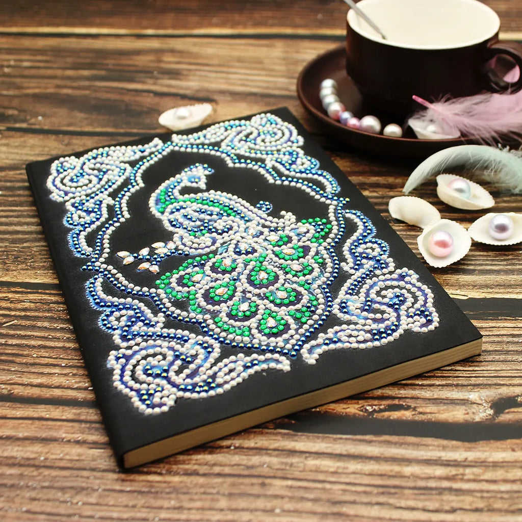Black A5 diamond painting notebook with peacock design featuring shaped and bright drill rhinestones