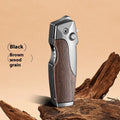 Metal folding lighter with an extended knife blade, shown in a black finish with wood grain texture.