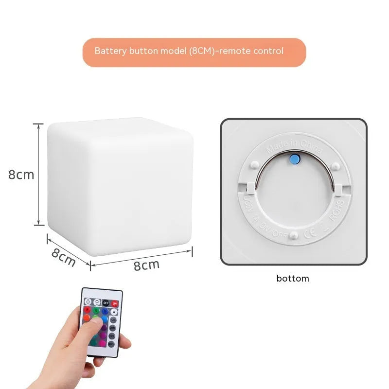 Small square night light showing seven colour changing modes, with remote control.