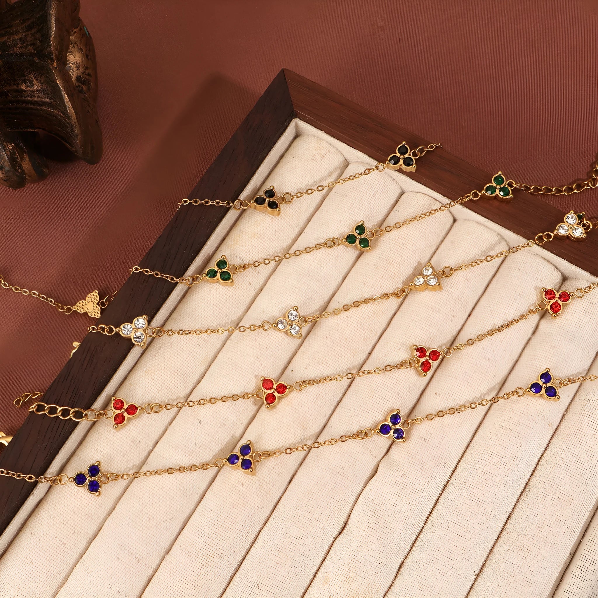 Women's stainless steel bracelet with three geometric diamond designs in various colour options