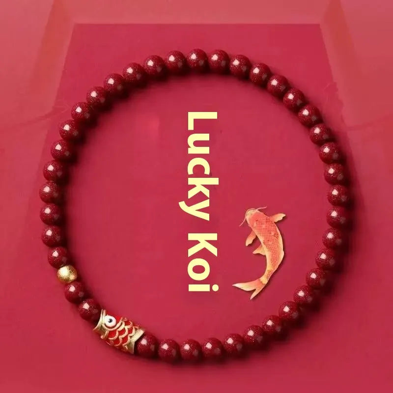 Natural cinnabar koi bracelet with golden ball charm in traditional Chinese style design