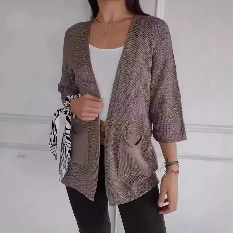 Women's thin waffle weave cardigan coat in army green with nine-quarter sleeves and pockets.