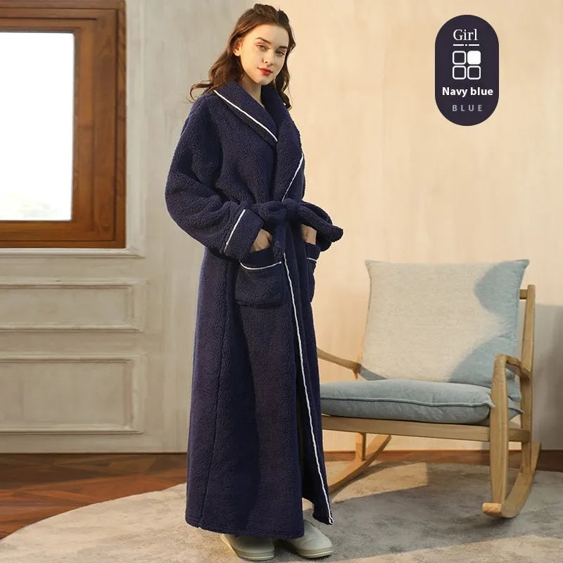 A man and woman wearing matching thickened flannel couple's bathrobes in a winter colour.