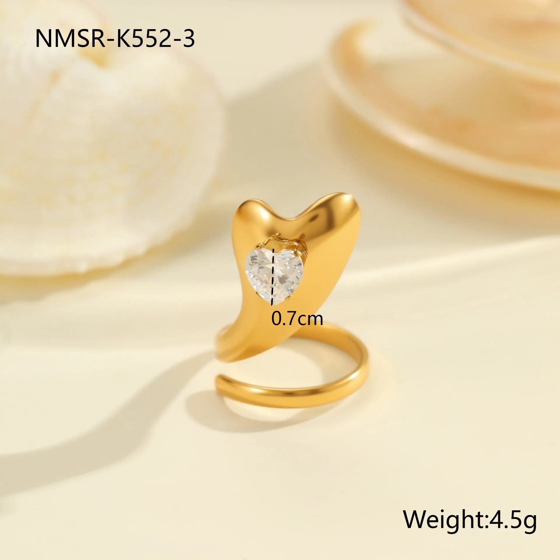 Geometric stainless steel zircon ring with open mouth design on a hand.