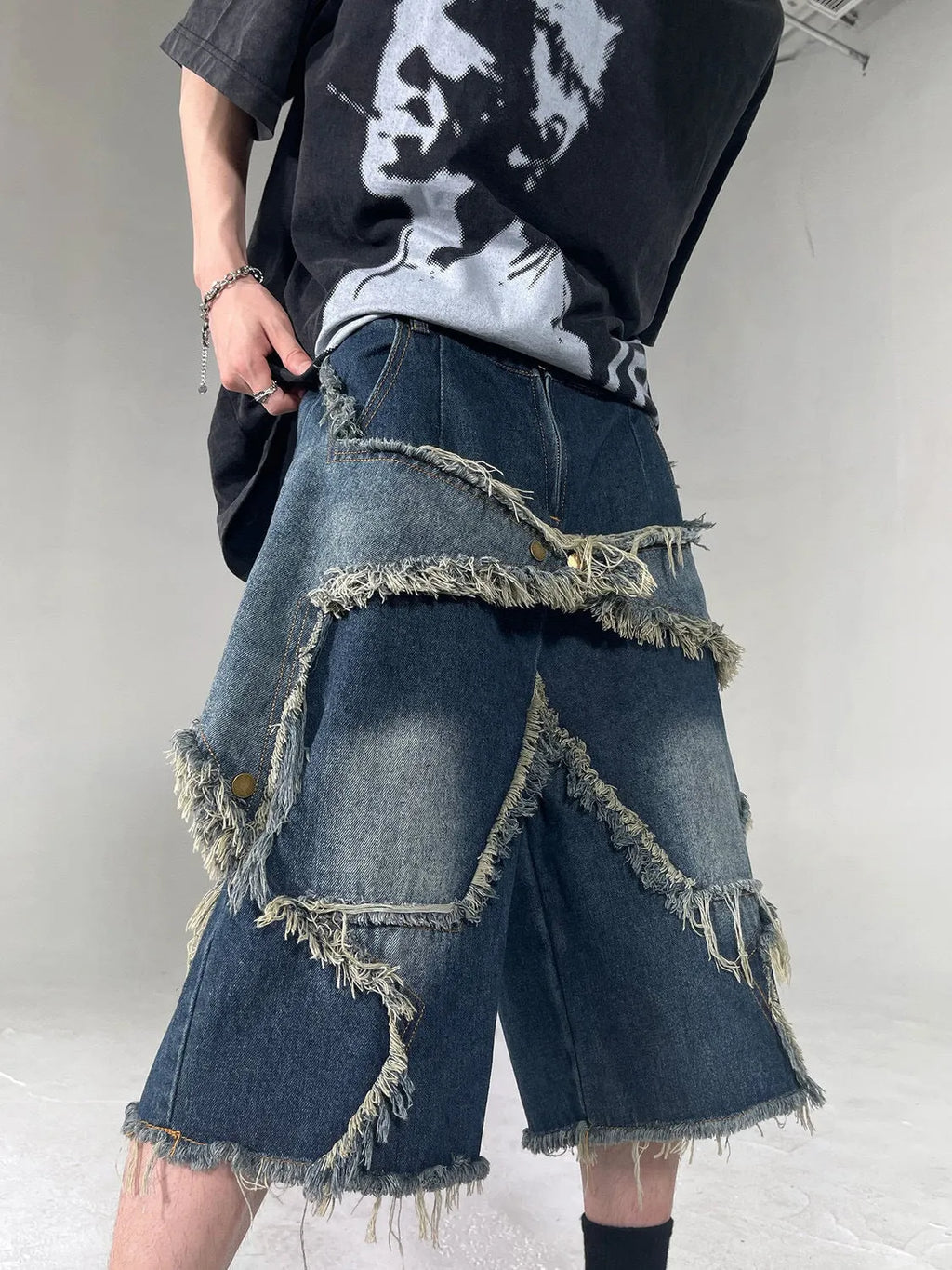 Blue denim shorts with frayed five-pointed star embroidery in loose fit style