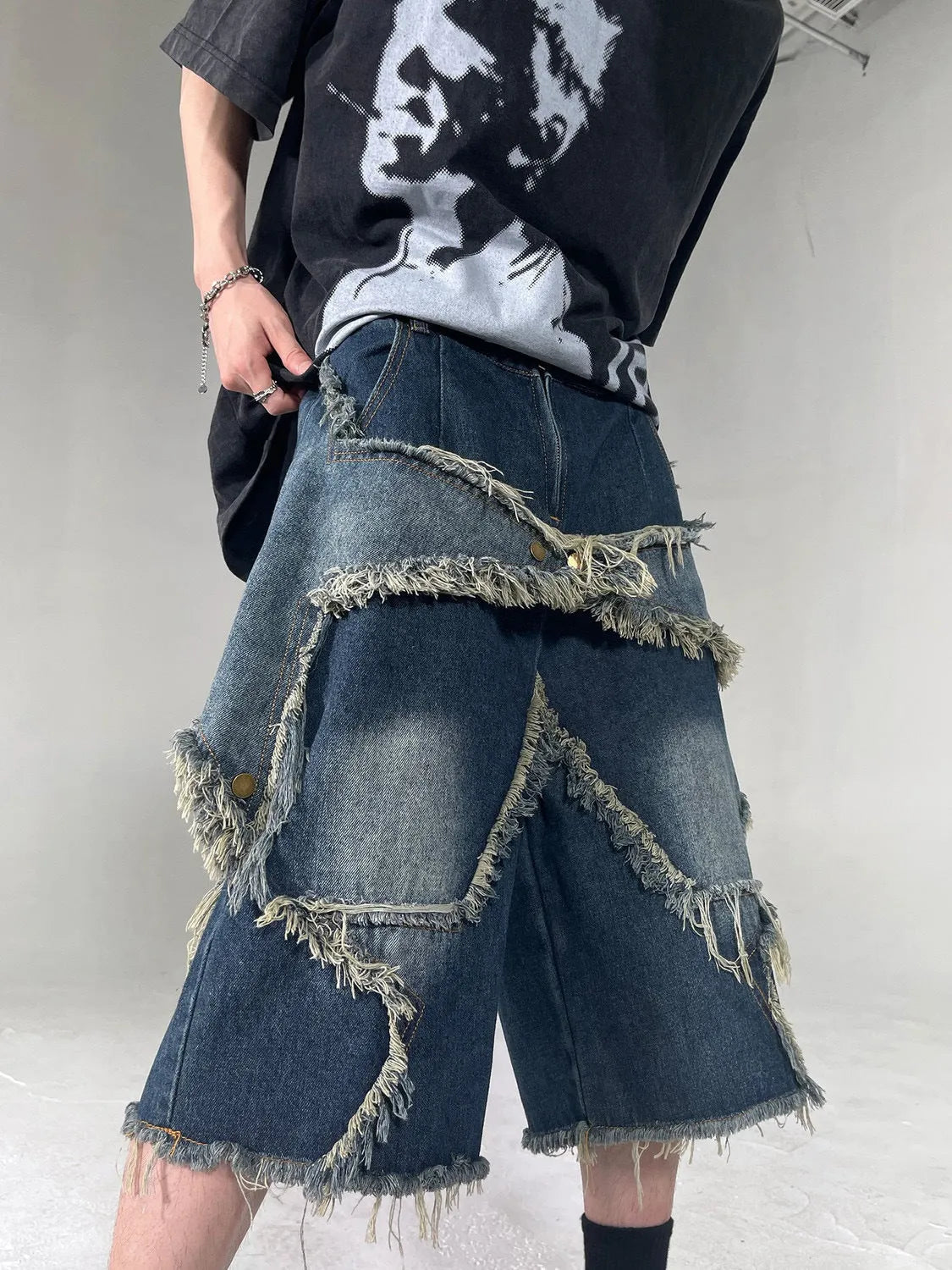 Blue denim shorts with frayed five-pointed star embroidery in loose fit style