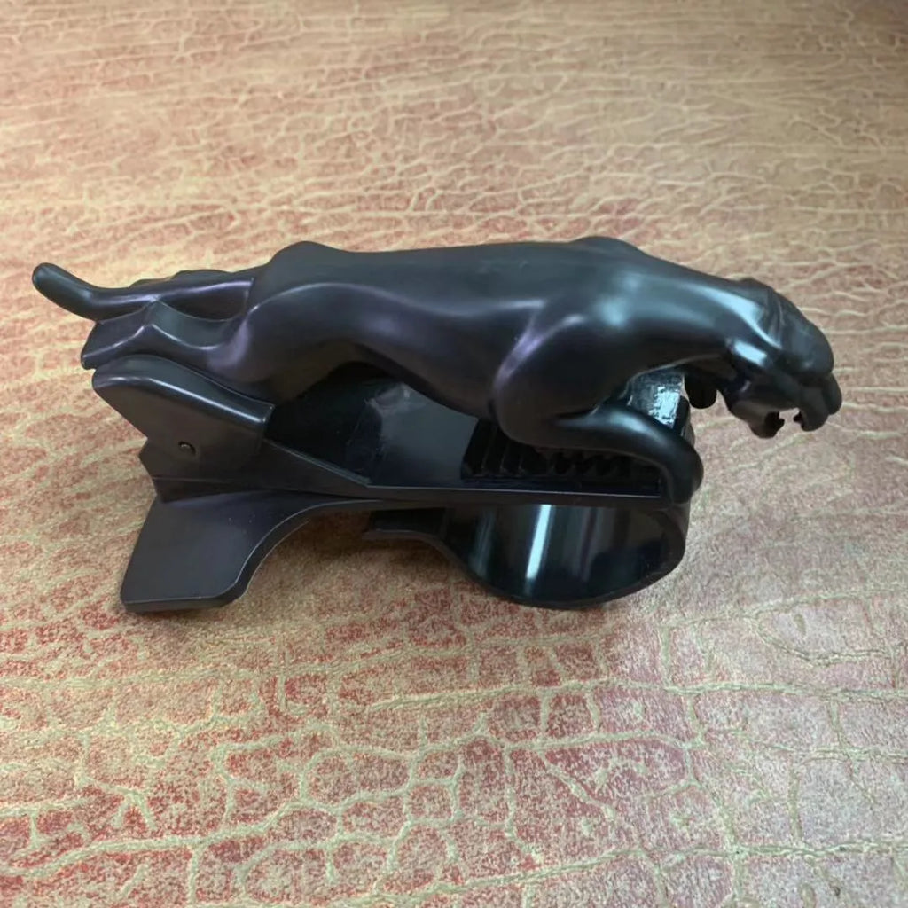 Black car phone holder with rotating bracket mounted on a windscreen