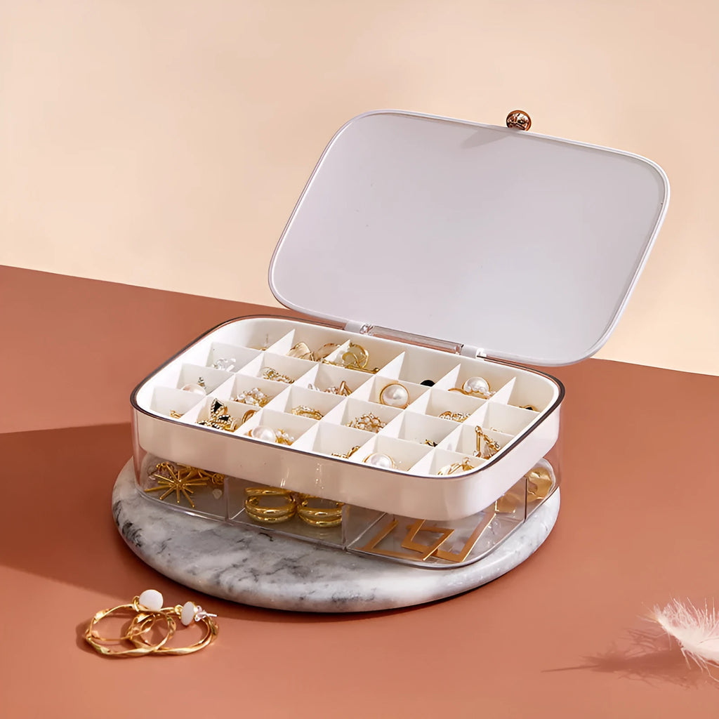 Green minimalist jewelry storage box with multiple layers for organised accessory storage