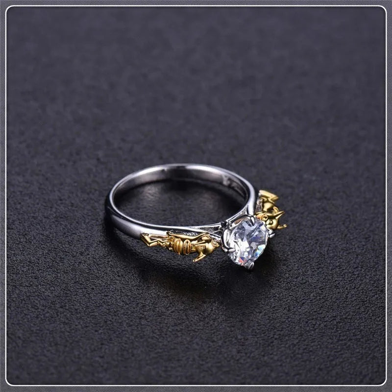 Crown-shaped copper cosplay ring with black gold finish and crystal detail.