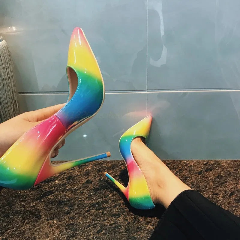Rainbow glossy patent leather high heel shoes with pointed toe and thin ultra-high heel.