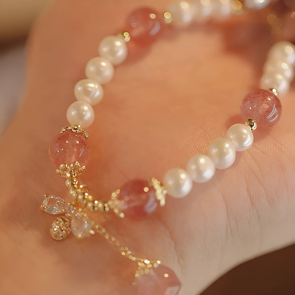 Women's crystal bracelet with strawberry quartz pearls and bow design