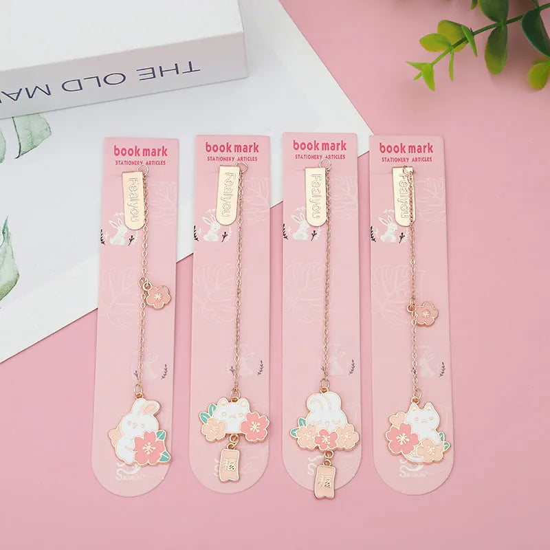 Creative cartoon metal pendant bookmark featuring cherry blossom cat and rabbit designs.