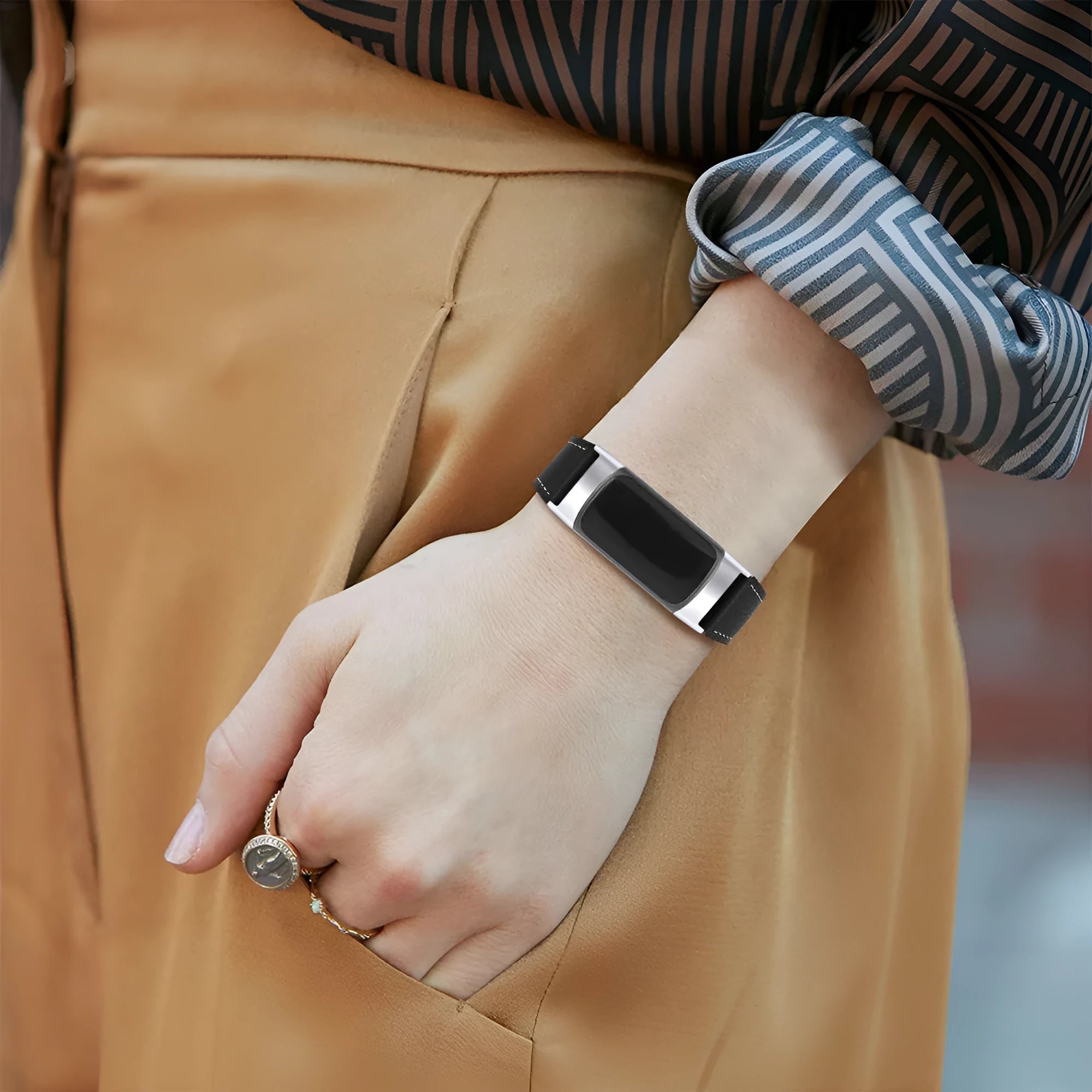 Genuine brown leather watch strap for Fitbit Charge 5 and Charge 6 smartwatches.