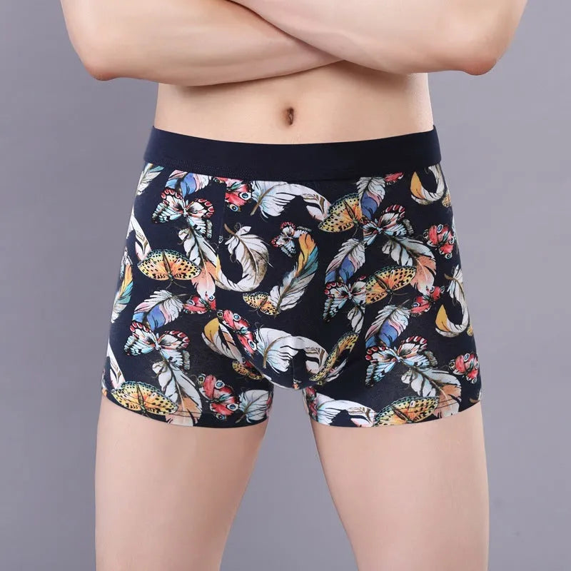 Men's cotton boxer shorts with floral print, showing mid-waist fit and U-shaped convex design.