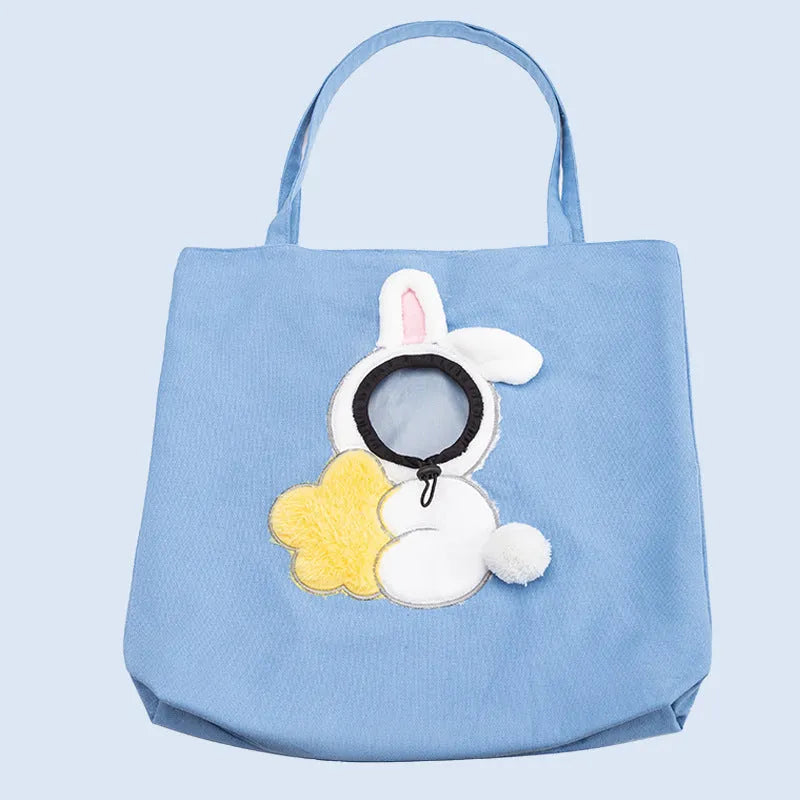 Little Bee Design canvas pet carrier shoulder bag with safety zippers and an adjustable elastic head opening for a cat or small dog.