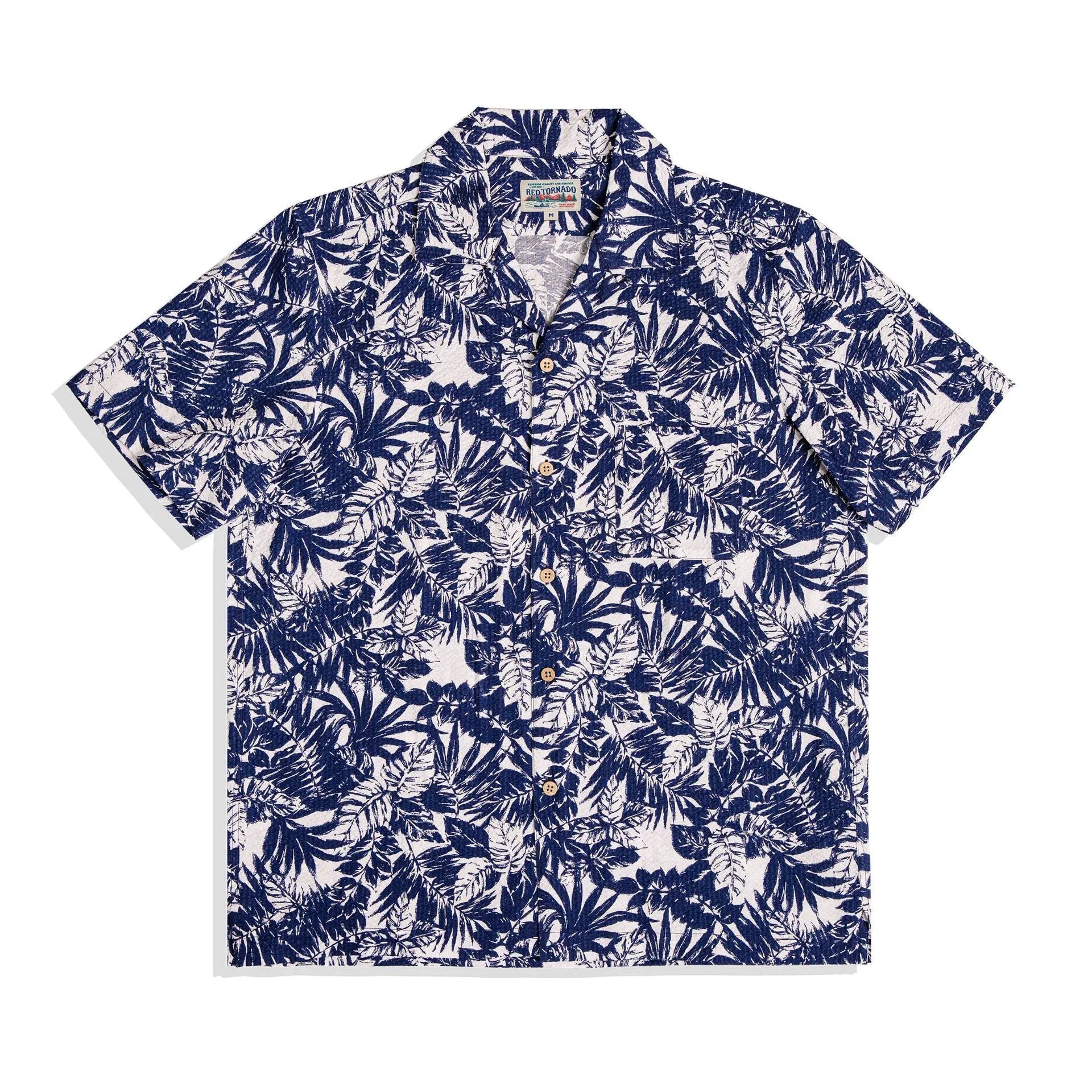 Man wearing a green vintage floral print seersucker shirt with a Cuban collar.