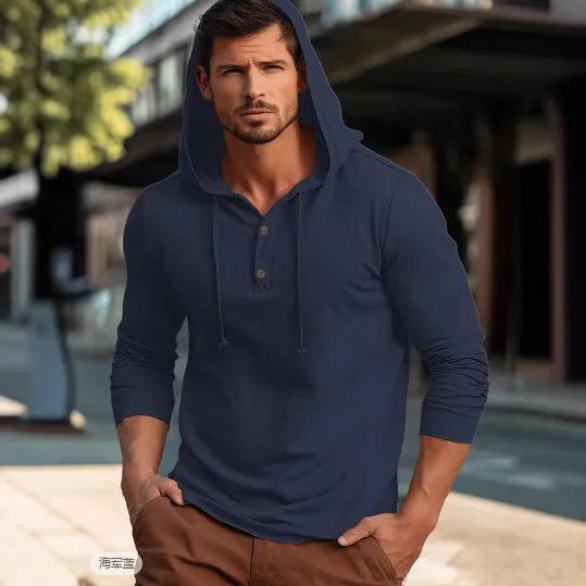A cotton pullover hoodie for youth in dark blue, shown in a casual setting.