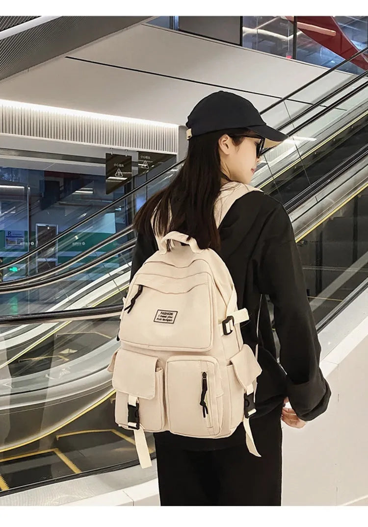 Black and white student backpack with computer compartment showing dimensions 31x12x41cm