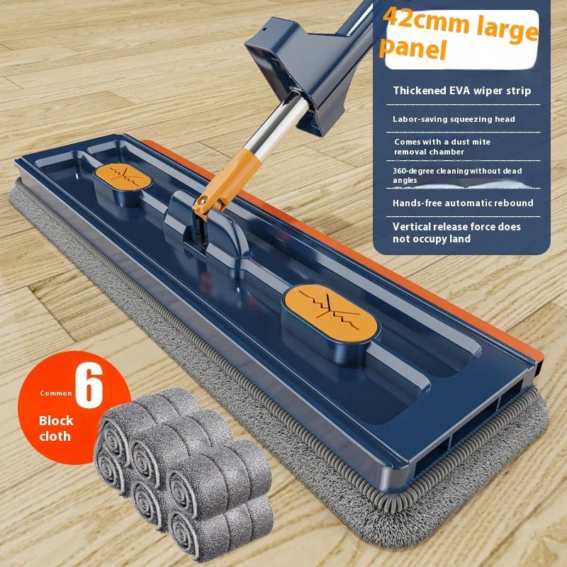 Large flat mop with blue cloth on a wooden floor, showing its 360-degree rotating head and long stainless steel handle.