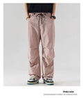 Man wearing loose straight-leg casual trousers in thin ice silk nylon fabric, showing apricot colour option.