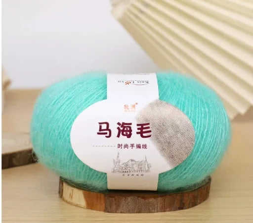 Mohair wool ball for DIY scarf knitting in assorted colours on white background