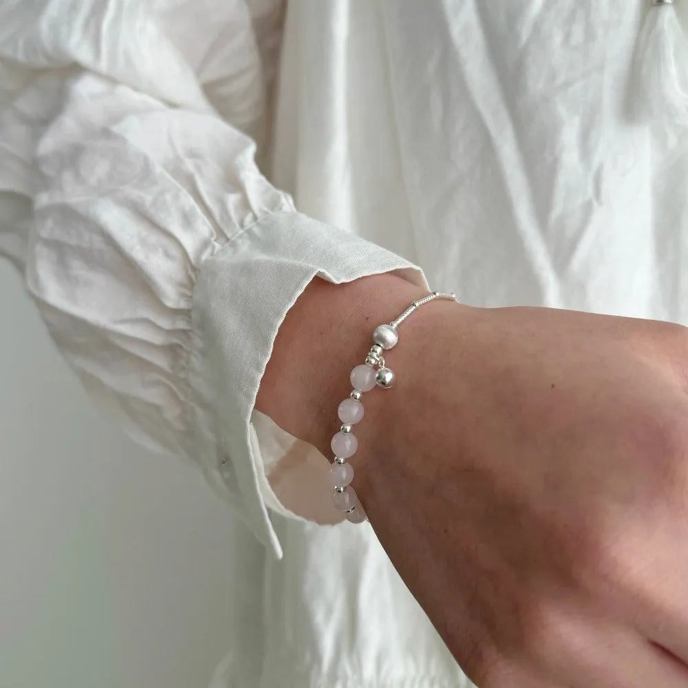 925 silver brushed ball bracelet with silver pink crystal electroplated finish on white background