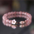Strawberry quartz peach blossom bracelet with crystal beads and floral charm on adjustable chain